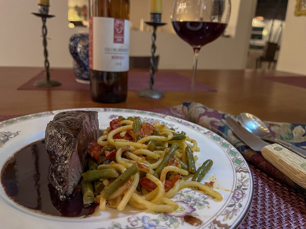 beef tenderloin steak with side of pasta