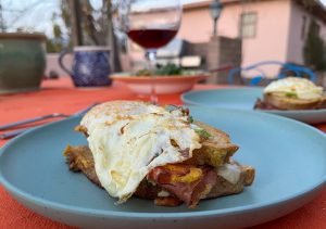 Croque Madame made on the BBQ served with a red burgundy