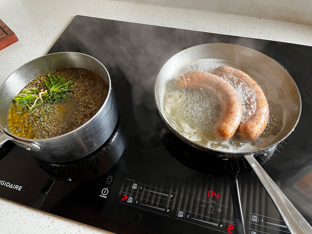 Lentils and sausage cooking